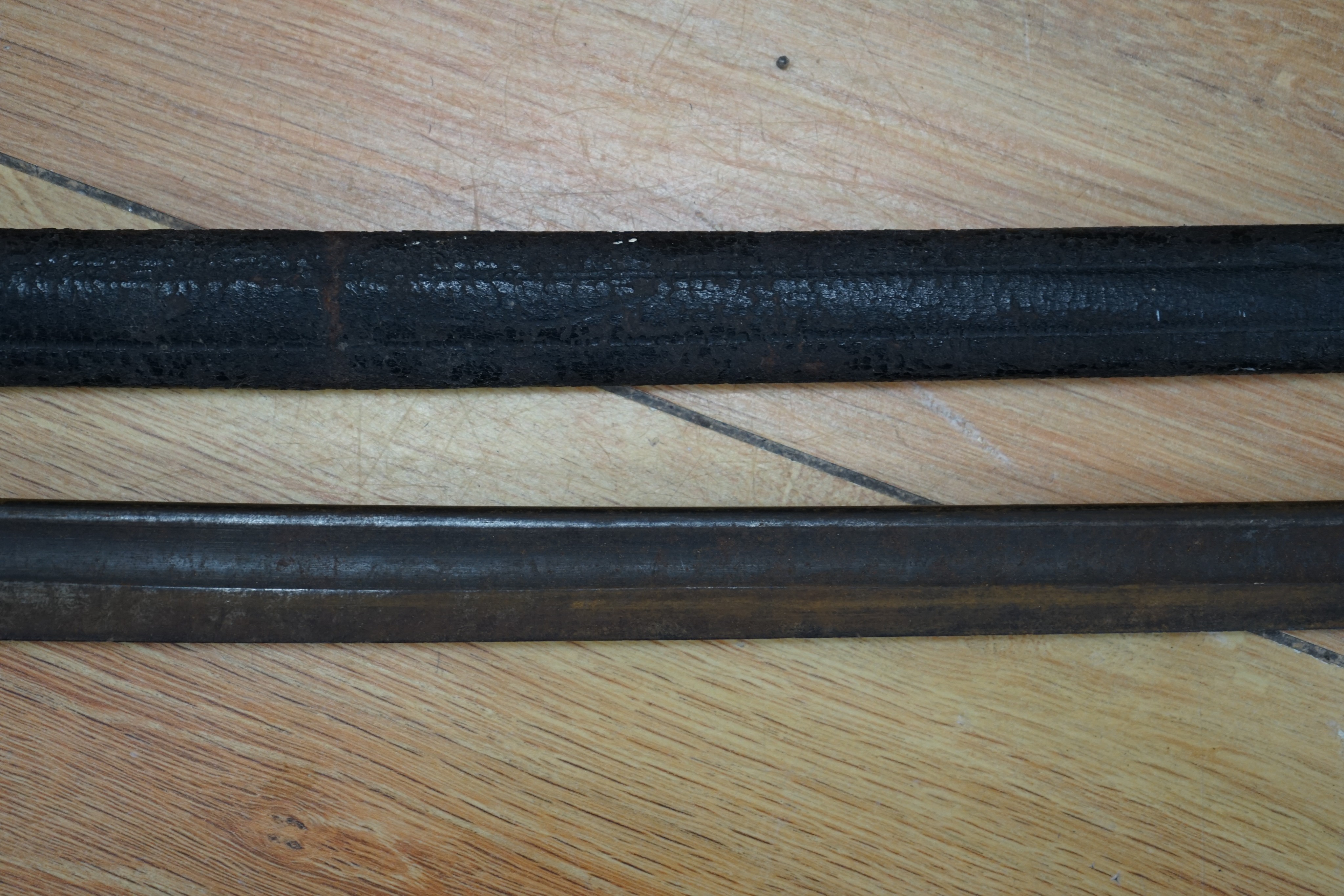 A Dutch East Indies short sword / kris having horn handle and gold inlay, another similar, a late 19th century sword and scabbard, an epee and another sword (5)